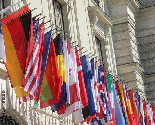 Flags of World hanging during the international meeting without people photo