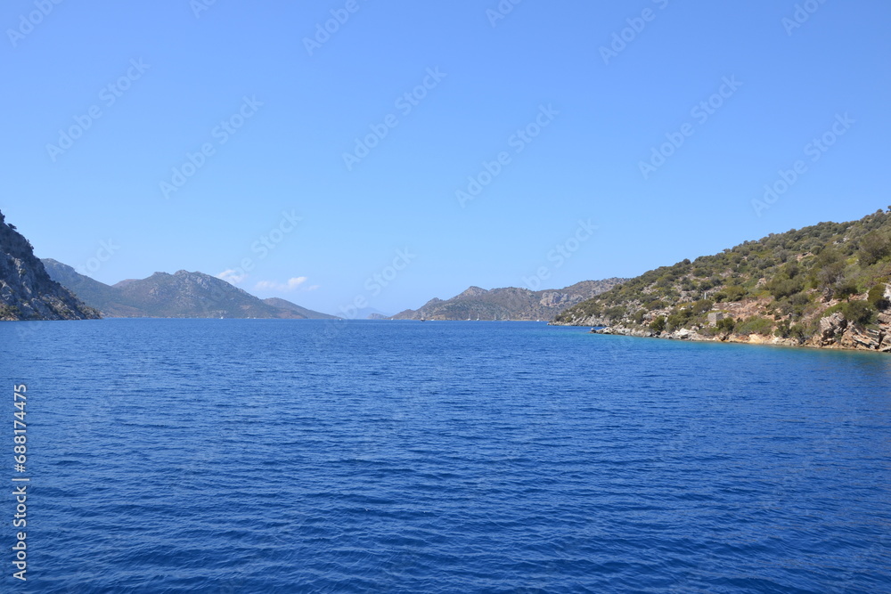 Mountain in the sea under the blue sky