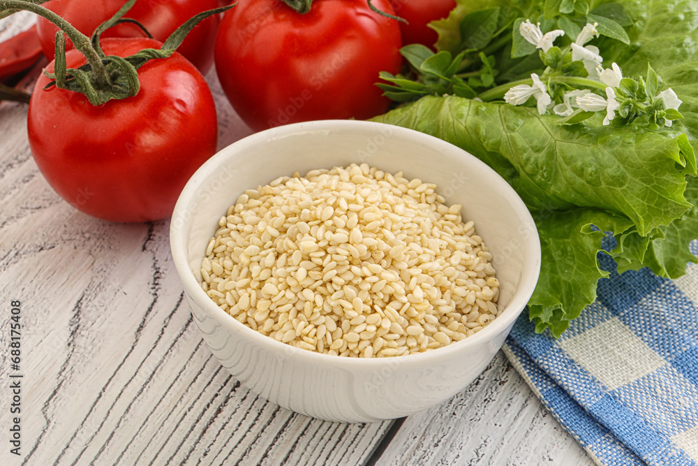 Raw sesame seeds in the bowl Raw sesame seeds in the bowl