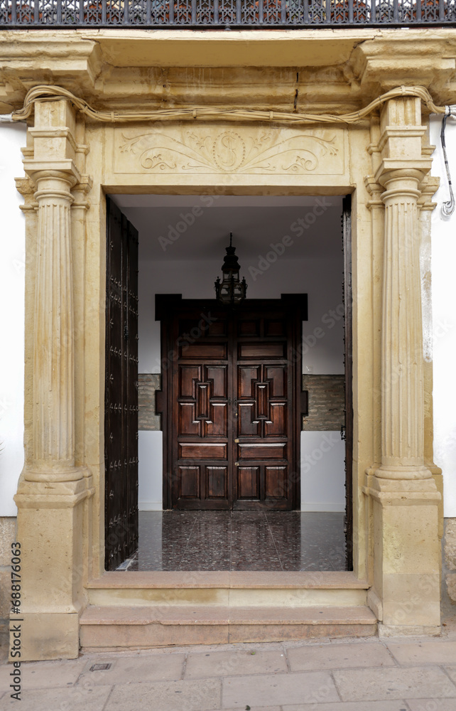 Obraz premium Old facade and entrance of majestic house in Ronda city