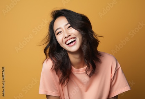 young asian woman smiling and laughing,