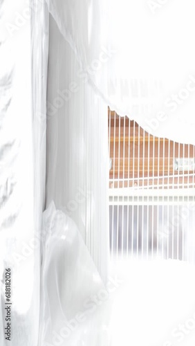 Moving transparent curtains at the window