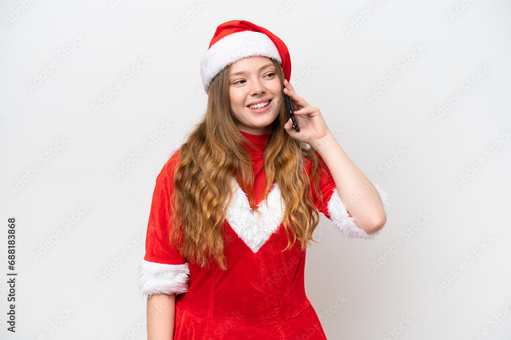 Young caucasian woman with Christmas dress isolated on white background keeping a conversation with the mobile phone Young caucasian woman with Christmas dress isolated on white background keeping a conversation with the mobile phone