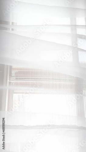 Moving transparent curtains at the window