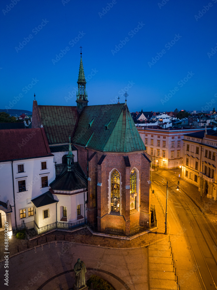 Picturesque old town Franciszkanska street and St Francis church during blue hour, Krakow, Poland
