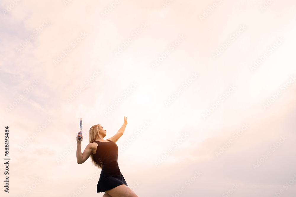 Tennis tournament. Female player at the clay tennis court Tennis tournament. Female player at the clay tennis court