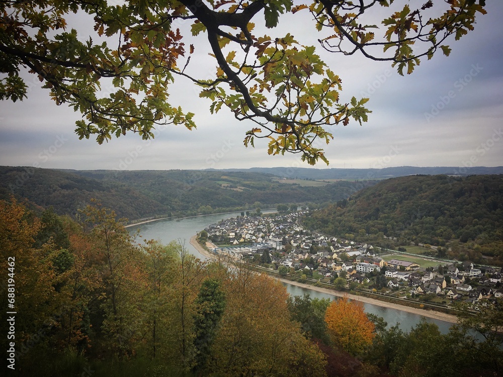 View of the Rhine river through the autumn trees near Braubach, Rhineland-Palatinate, Germany, October 2018