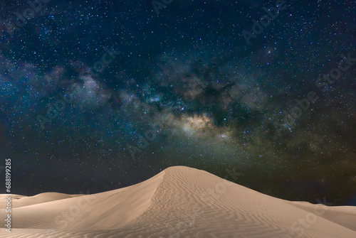 Natural park of Maspalomas dunes in Gran Canaria with the Milky Way, Canary Islands, Spain