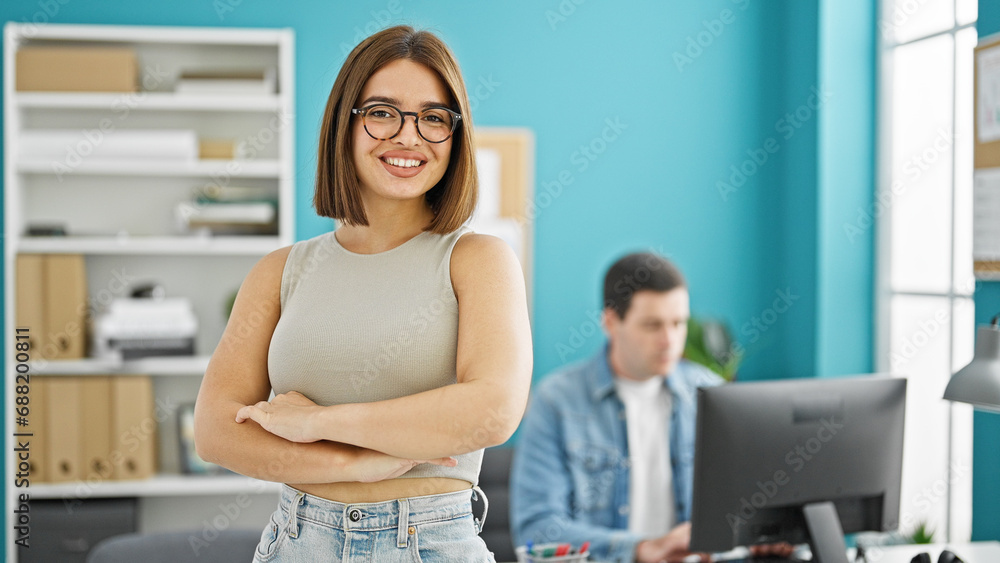 Two workers man and woman standing with arms crossed gesture working at the office Two workers man and woman standing with arms crossed gesture working at the office