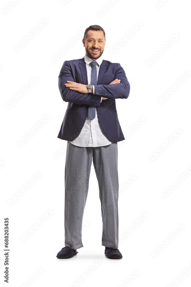 Full length portrait of a businessman in a suit and bottom pajamas Full length portrait of a businessman in a suit and bottom pajamas