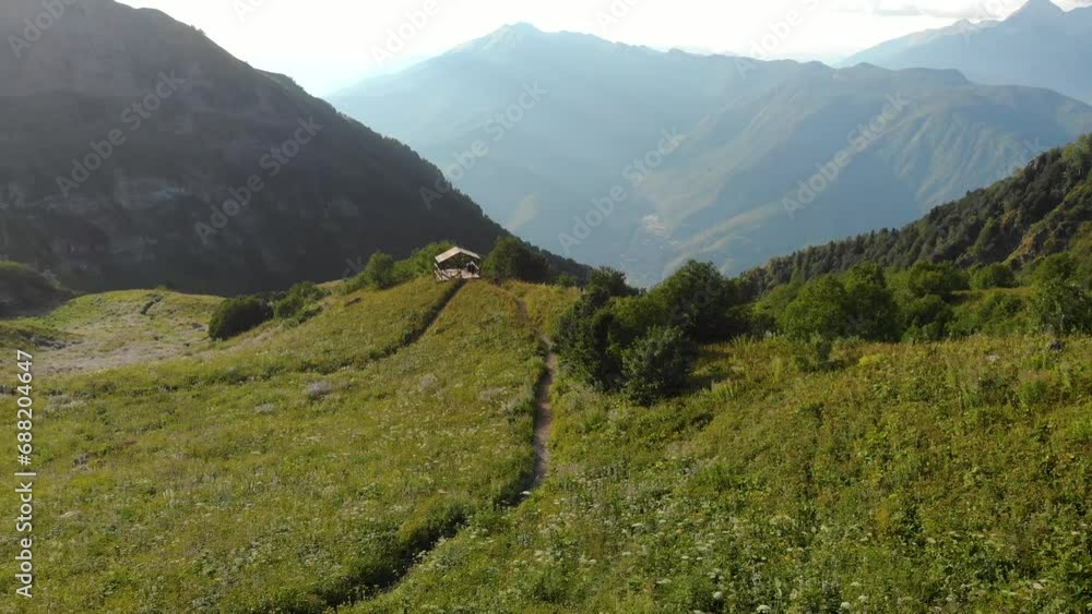 Magnificent mountain landscape, drone video. Mountain valley with lush green grass, unity with nature, gazebo on a mountain meadow, Magnificent mountain landscape, drone video. Mountain valley with lush green grass, unity with nature, gazebo on a mountain meadow,