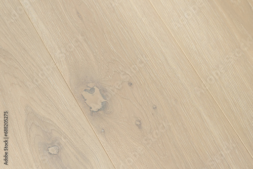 Texture of natural ivory oak parquet. Wooden boards for polished laminate. Background of blank hardwood floor