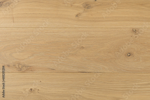 Texture of natural oak parquet close-up. Wooden boards for polished laminate. Hardwood sample background photo