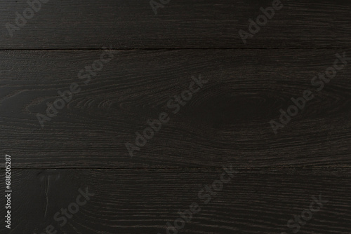 Texture of natural dark oak parquet close-up. Wooden boards for polished laminate. Hardwood sample background photo