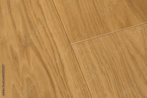 Texture of natural oak parquet. Wooden boards for polished laminate. Background of blank hardwood floor