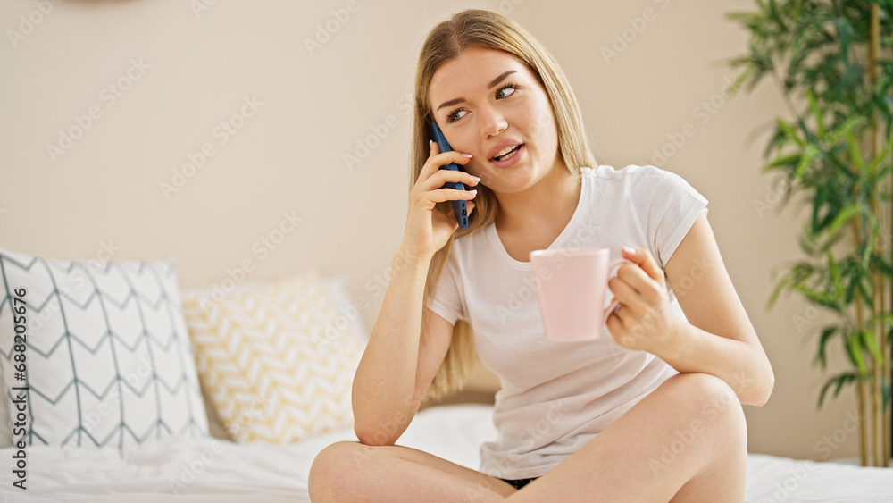 Young blonde woman talking on smartphone drinking coffee at bedroom Young blonde woman talking on smartphone drinking coffee at bedroom