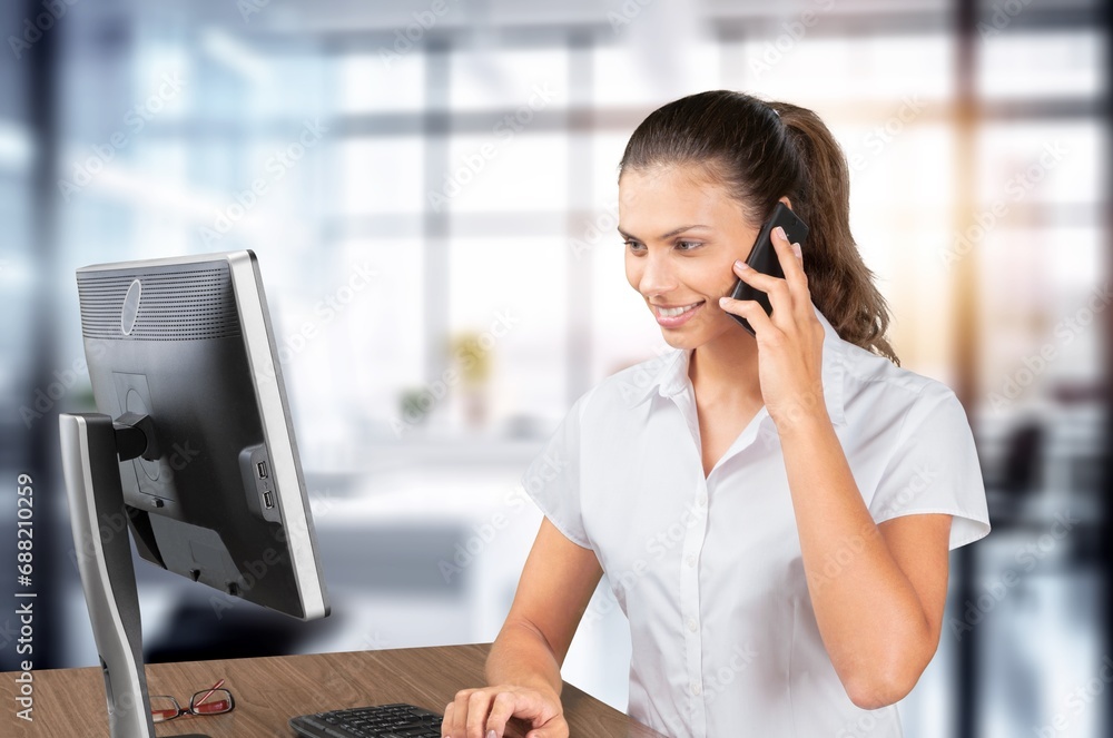 Portrait of smiling customer service worker with phone Portrait of smiling customer service worker with phone