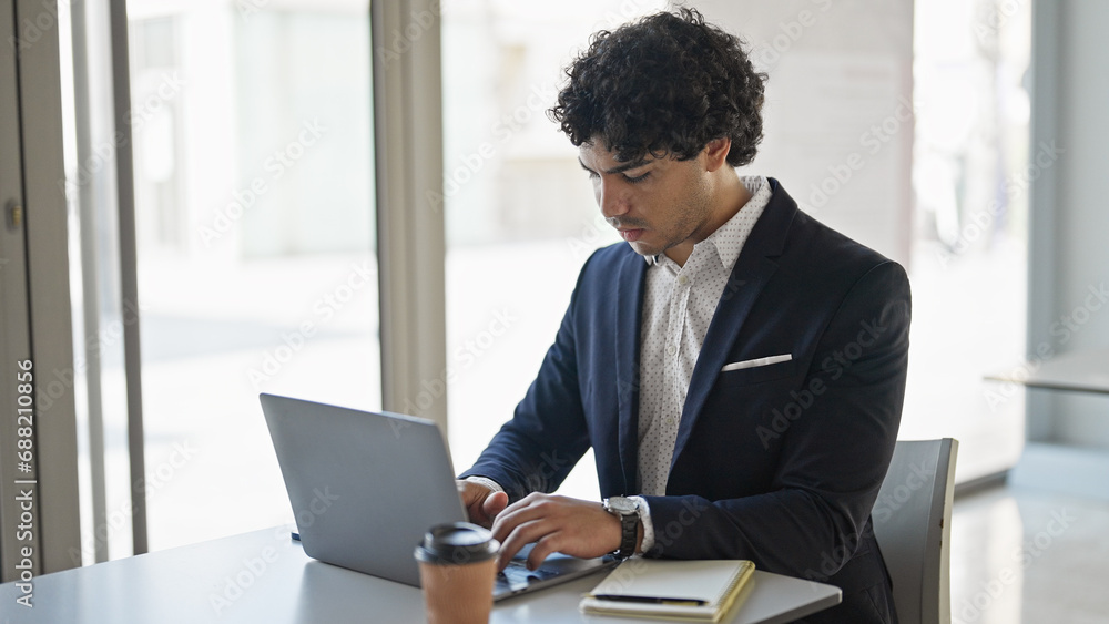 Young latin man business worker using laptop at office Young latin man business worker using laptop at office