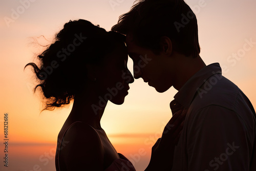 A romantic couple, sky at sunset, capturing an intimate and tender moment. Copy space