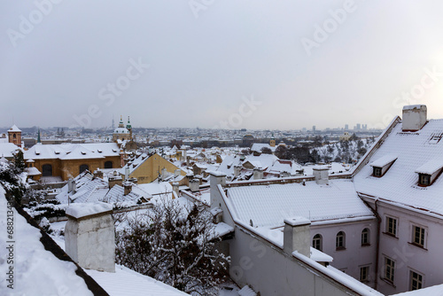 Romantic snowy Prague Lesser Town historical Roofs, Czech Republic