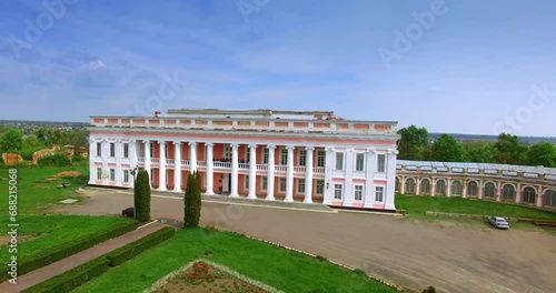 Group of tourists standing on the second floor of the palace in Tulchyn, Vinnytsia region, Ukraine. Drone footage rising above the historical ensemble. photo