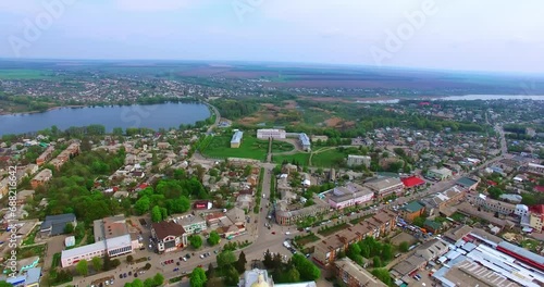 Flying above the usual panorama of Ukrainian city. Drone footage above the low-rise architecture of the town. photo