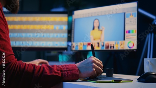 Konstfotografi Expert photo editor browsing through photoshoot images to find and fix faulty spots using graphic tablet, close up