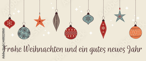 Frohe Weihnachten und ein gutes neues Jahr – Schriftzug in deutscher Sprache. Weihnachtskarte mit bunten Christbaumkugeln. photo