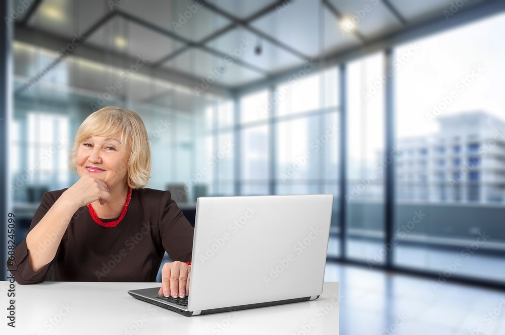 Mature female worker in modern office Mature female worker in modern office