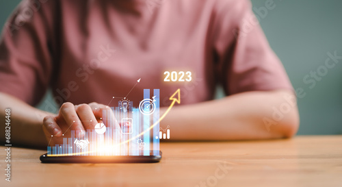2023 Planning invest indicators long-term. Businesswoman analyzes profitability of working company with digital virtual screen graphics, positive, businesswoman calculates financial data investments.