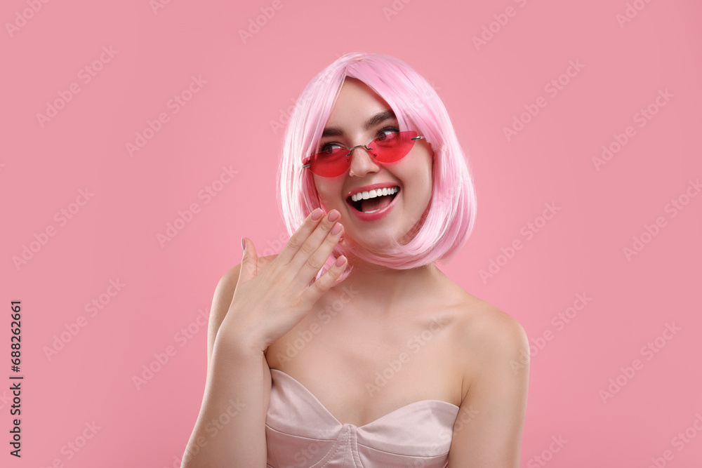 Pink look. Beautiful girl in wig and bright sunglasses on color background Pink look. Beautiful girl in wig and bright sunglasses on color background