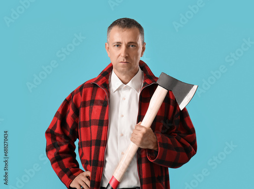 Wallpaper Mural Portrait of adult lumberjack with axe on blue background Torontodigital.ca
