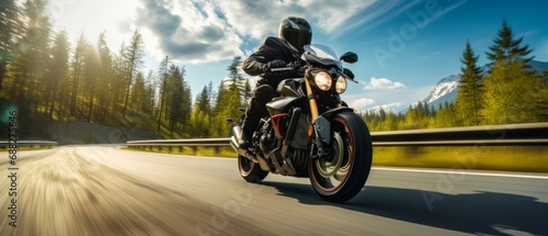 A motorcycle rider speeding on a road photo