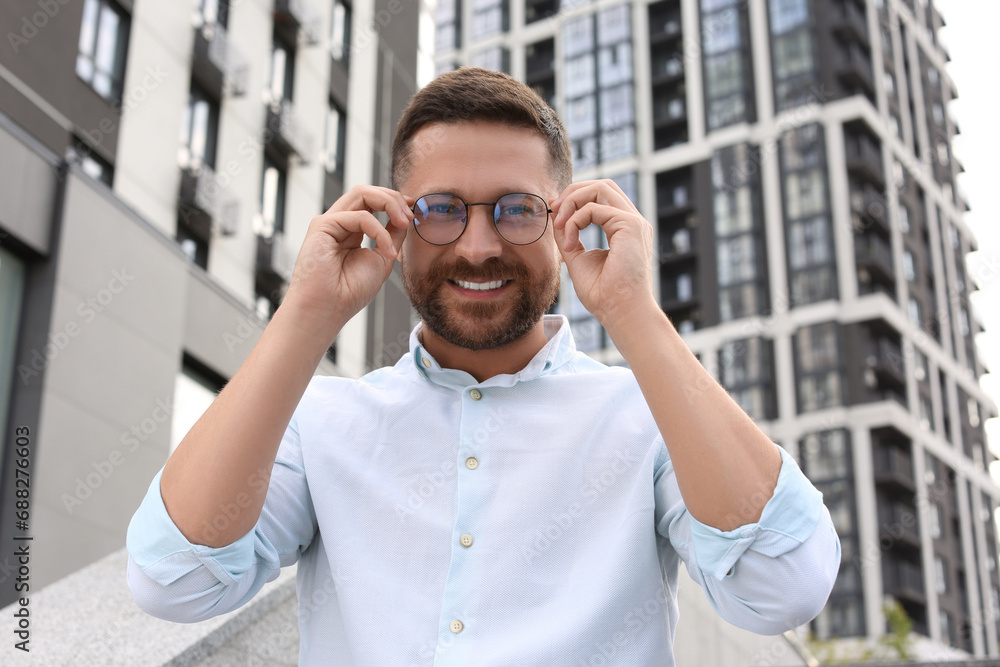 Portrait of handsome bearded man in glasses outdoors Portrait of handsome bearded man in glasses outdoors