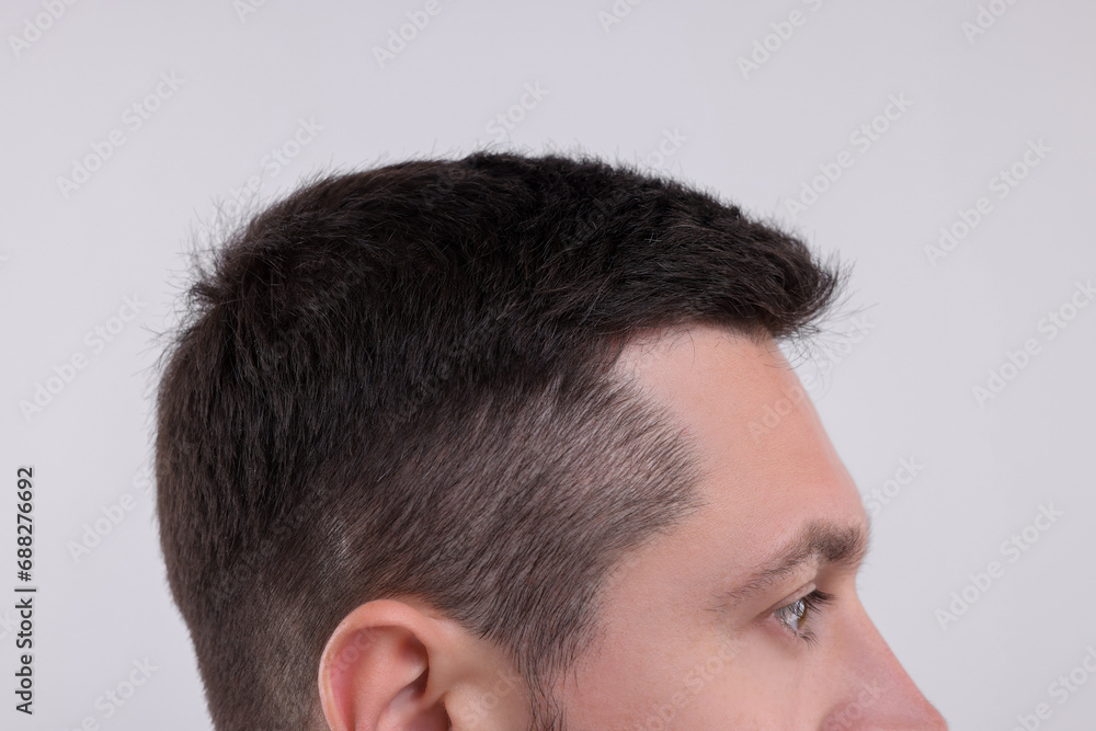 Man with healthy hair on white background, closeup Man with healthy hair on white background, closeup