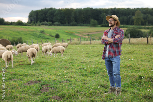 Smiling man on pasture at farm. Space for text © New Africa