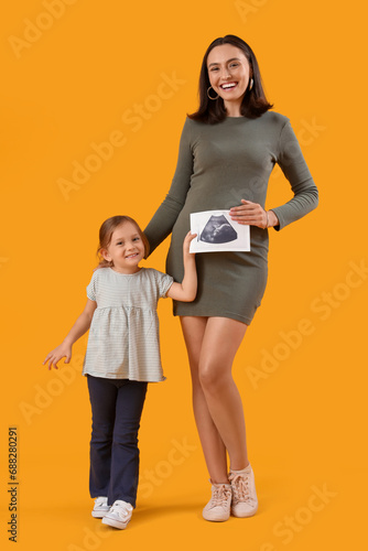 Beautiful pregnant mother a...