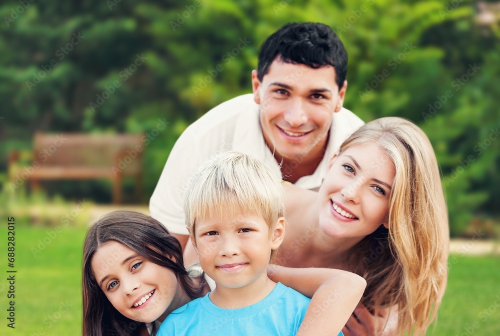 Happy young family have fun in the garden Happy young family have fun in the garden