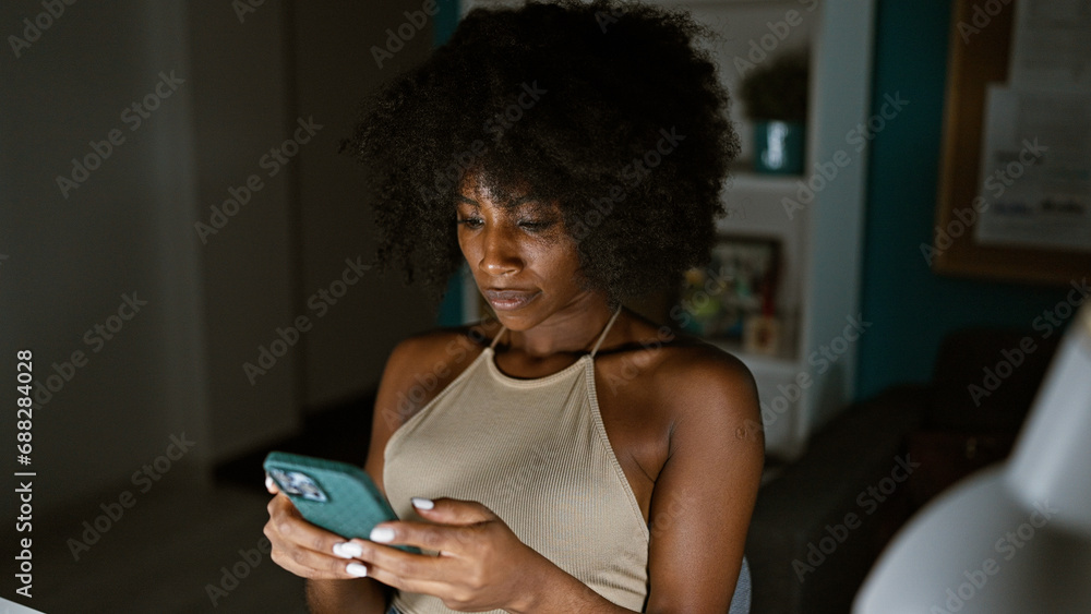 African american woman business worker using smartphone working at the office African american woman business worker using smartphone working at the office