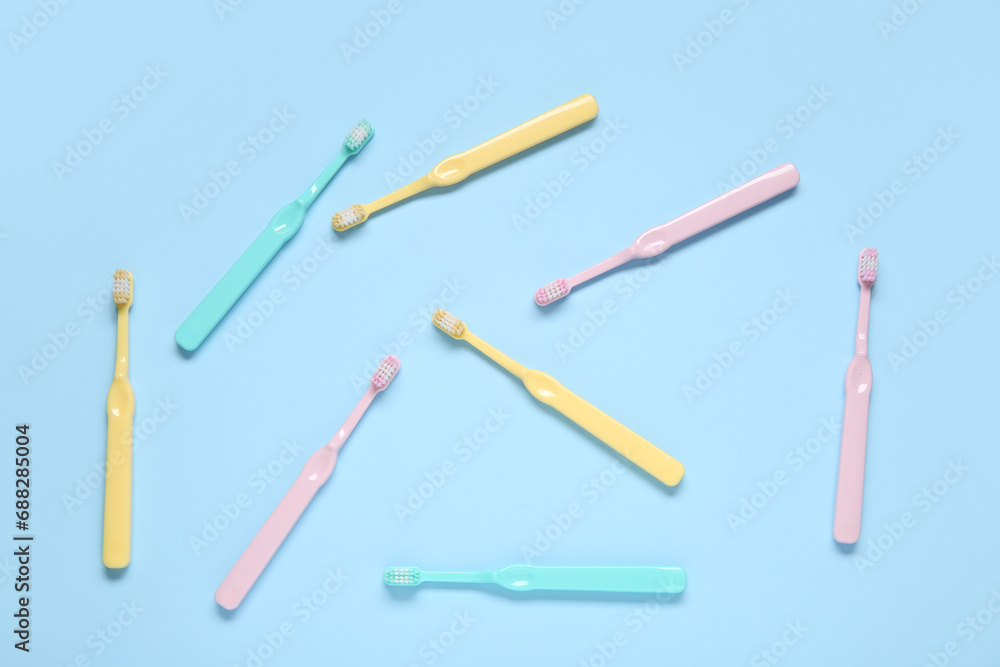 Colorful toothbrushes on blue background. Colorful toothbrushes on blue background.
