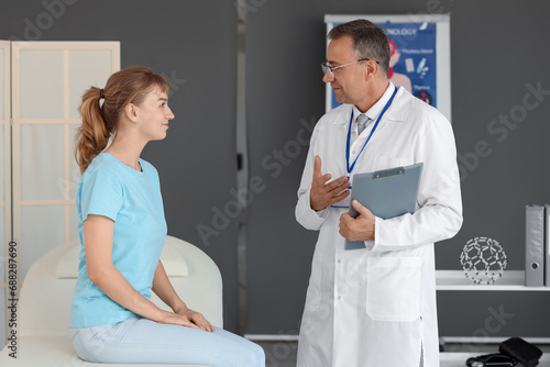 Mature doctor working with ...