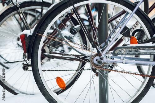 Bicycle wheels in snow.Snowy winter weather.Bicycle traffic in winter. Traffic in winter season