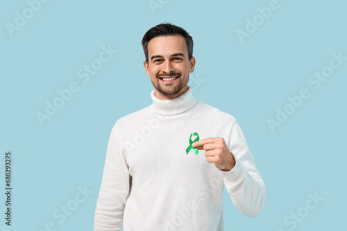 Handsome adult man with gre...