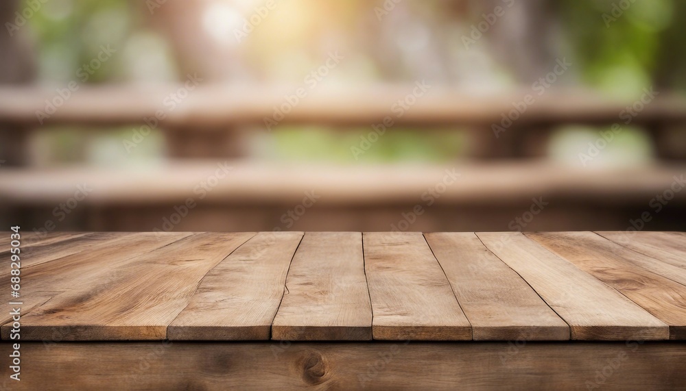 Wooden table top on blur background with bokeh image. Wooden table top on blur background with bokeh image.