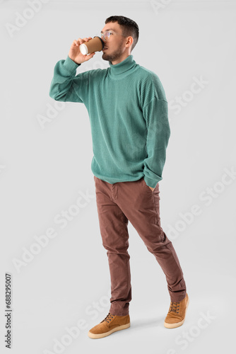 Young man in eyeglasses dri...