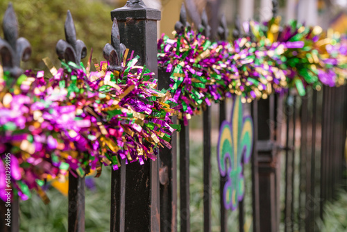 Mardi Gras decorations in the French Quarter in New Orleans in the colors of purple, gold and green. photo