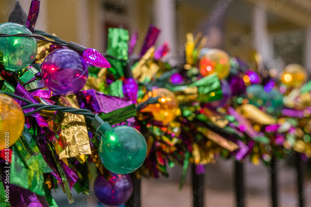 Mardi Gras decorations in the French Quarter in New Orleans in the colors of purple, gold and green. Mardi Gras decorations in the French Quarter in New Orleans in the colors of purple, gold and green.