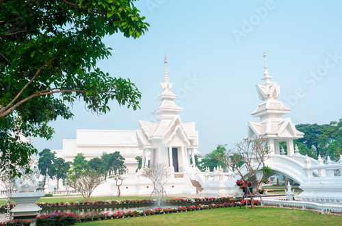 Amongst surreal structures,in the grounds of Wat Rong Khun,fantastical White Temple,Chiang Rai Province,Northern Thailand.