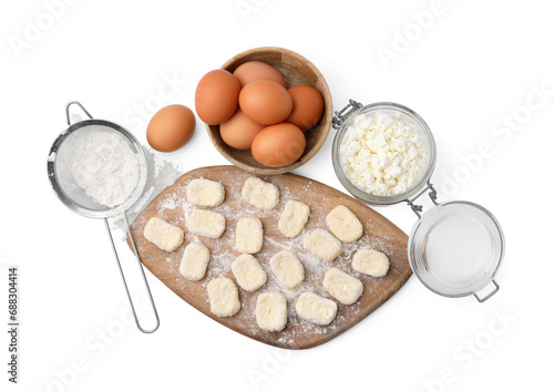 Making lazy dumplings. Wooden board with cut dough and ingredients isolated on white, top view