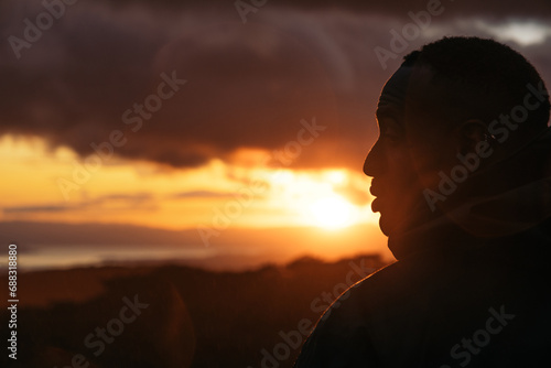 Man watching the sunset in nature